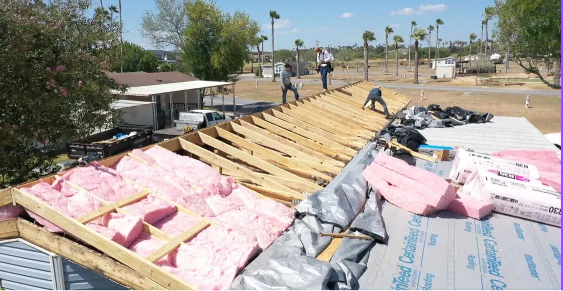 New insulation installed between the new roof framing
